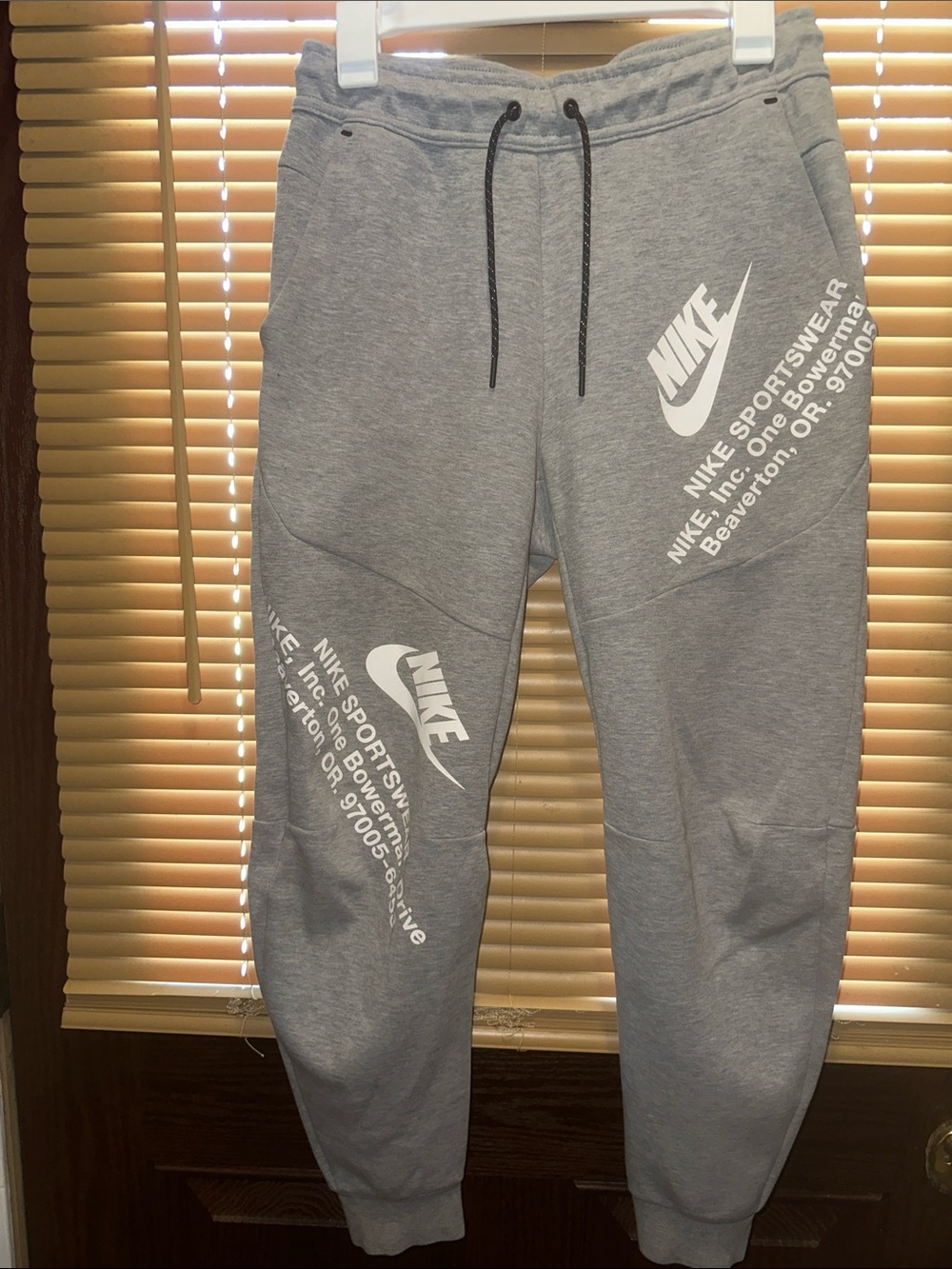 Nike Gray Sweatpants with White Logo Graphics